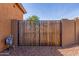 Utility gate with wooden fence at 30804 N 120Th Ave, Peoria, AZ 85383