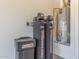 This is a utility room with water softener and hot water heater at 30804 N 120Th Ave, Peoria, AZ 85383