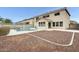 Backyard view featuring a gated pool with a rock landscape at 3115 W Molly Ln, Phoenix, AZ 85083