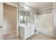 Bright bathroom with tub/shower combo, neutral colors, and tiled floor at 3115 W Molly Ln, Phoenix, AZ 85083