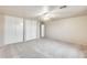 Bright and spacious bedroom features carpet, a ceiling fan, and ample closet space at 3115 W Molly Ln, Phoenix, AZ 85083