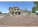 Charming two-story home with a desert landscape, tile roof, covered porch and a two car garage at 3115 W Molly Ln, Phoenix, AZ 85083