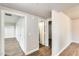 Well-lit hallway featuring vinyl plank flooring and neutral paint at 3115 W Molly Ln, Phoenix, AZ 85083