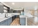 Kitchen with an island, stainless steel appliances, and wooden floors at 3115 W Molly Ln, Phoenix, AZ 85083