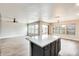 Bright open living space with recessed lighting, modern ceiling fan and large windows overlooking backyard at 3115 W Molly Ln, Phoenix, AZ 85083