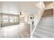 Open-concept living room with lots of windows and staircase at 3115 W Molly Ln, Phoenix, AZ 85083