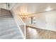 Entryway featuring a staircase, wood flooring, neutral paint, and a modern chandelier at 3115 W Molly Ln, Phoenix, AZ 85083