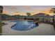 Relaxing backyard pool area with rock waterfall, desert landscaping, and block wall for complete privacy at 3115 W Molly Ln, Phoenix, AZ 85083