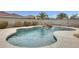 Inviting backyard pool with a rock waterfall feature, surrounded by desert landscaping and privacy fence at 3115 W Molly Ln, Phoenix, AZ 85083