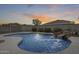 Backyard pool featuring a waterfall feature and a surrounding fence with desert landscaping at 3115 W Molly Ln, Phoenix, AZ 85083