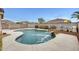 A backyard pool with a rock waterfall feature at 3115 W Molly Ln, Phoenix, AZ 85083