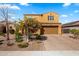 Inviting two-story home with landscaped front yard, brick driveway, and attached two-car garage under a sunny sky at 3322 E Lantana Pl, Chandler, AZ 85286