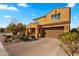 Charming two-story home with lush landscaping, a brick driveway, and an attached two-car garage on a bright day at 3322 E Lantana Pl, Chandler, AZ 85286