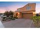 Inviting two-story home featuring a well-manicured yard, brick driveway, and an attached two-car garage at 3322 E Lantana Pl, Chandler, AZ 85286