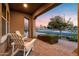 Inviting front porch with seating and a view of the manicured landscaping at 3322 E Lantana Pl, Chandler, AZ 85286