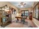 Comfortable home office featuring a wooden desk, built-in shelving, and neutral tones at 3322 E Lantana Pl, Chandler, AZ 85286