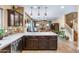 Open kitchen with a center island, pendant lighting, and views of the adjacent living area at 3322 E Lantana Pl, Chandler, AZ 85286