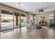 Bright living room features tile floors, sliding doors to the pool, and comfortable seating at 3322 E Lantana Pl, Chandler, AZ 85286