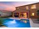 Evening shot of a private pool and covered patio in the backyard of this lovely home at 3322 E Lantana Pl, Chandler, AZ 85286