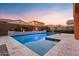 Gorgeous backyard featuring a sparkling pool and inviting seating area with travertine tile deck at 3322 E Lantana Pl, Chandler, AZ 85286