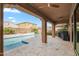 Enjoy relaxing afternoons by this sparkling pool with travertine tile and covered patio at 3322 E Lantana Pl, Chandler, AZ 85286