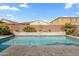 Sparkling pool features travertine tile, mature landscape, and fountain feature at 3322 E Lantana Pl, Chandler, AZ 85286