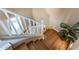 Bright staircase features hardwood steps, white risers, and a white handrail at 3322 E Lantana Pl, Chandler, AZ 85286