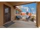 A partially covered back patio with a grill and seating at 35207 N Central Ave, Phoenix, AZ 85086