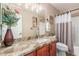 Bathroom with granite countertops, a sink, a toilet, and a shower/tub at 35207 N Central Ave, Phoenix, AZ 85086