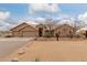 Exterior showcasing desert landscaping, three-car garage, and a charming, well-maintained facade at 35207 N Central Ave, Phoenix, AZ 85086