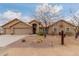 Charming single-story home featuring a well-manicured desert landscape and three-car garage at 35207 N Central Ave, Phoenix, AZ 85086