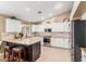 Spacious kitchen with white cabinetry, granite countertops, and stainless steel appliances at 35207 N Central Ave, Phoenix, AZ 85086