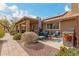 Inviting outdoor patio with comfortable seating, lush landscaping, and built-in grill, perfect for relaxing and entertaining at 35207 N Central Ave, Phoenix, AZ 85086