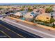 Scenic aerial view of a residential area featuring backyard swimming pools and lush green landscaping at 3581 W Mineral Butte Dr, San Tan Valley, AZ 85144