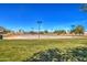 Community basketball court featuring well-maintained court, clear skies, and surrounding grassy area at 3581 W Mineral Butte Dr, San Tan Valley, AZ 85144