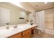 Well-lit bathroom features a spacious countertop with a sink and shower with bathtub at 3581 W Mineral Butte Dr, San Tan Valley, AZ 85144