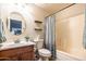 Well-lit bathroom features a sink, toilet, and shower-tub combination at 3581 W Mineral Butte Dr, San Tan Valley, AZ 85144