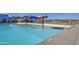 Well-maintained community pool featuring a colorful splash pad and ample space for Gathering fun at 3581 W Mineral Butte Dr, San Tan Valley, AZ 85144