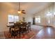 Open dining room featuring a large table, vaulted ceiling, and natural light at 3581 W Mineral Butte Dr, San Tan Valley, AZ 85144