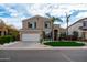 Charming two-story home with a well-maintained lawn, beautiful landscaping, and a two-car garage at 3581 W Mineral Butte Dr, San Tan Valley, AZ 85144