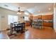 Eat-in kitchen with stainless steel appliances, wood cabinets, and a cozy dining area at 3581 W Mineral Butte Dr, San Tan Valley, AZ 85144