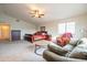 Spacious bedroom featuring a seating area, ceiling fan and large window providing lots of natural light at 3581 W Mineral Butte Dr, San Tan Valley, AZ 85144