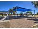 Gathering-friendly playground area featuring modern play equipment, shade structures, and picnic facilities at 3581 W Mineral Butte Dr, San Tan Valley, AZ 85144