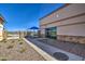 View of the pool entrance and community building with walkway, landscaping and stone accents at 3581 W Mineral Butte Dr, San Tan Valley, AZ 85144