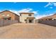 A large, spacious backyard with a covered patio and block fence with room for customization at 35973 W Velazquez Dr, Maricopa, AZ 85138