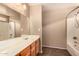 Bathroom vanity featuring a tile floor, shower and tub combination at 35973 W Velazquez Dr, Maricopa, AZ 85138