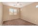 Bedroom featuring carpet flooring and a window offering natural light at 35973 W Velazquez Dr, Maricopa, AZ 85138