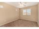 Bedroom featuring carpet flooring and a window offering natural light at 35973 W Velazquez Dr, Maricopa, AZ 85138