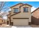 Charming two-story home with a neutral color palette and a convenient attached two-car garage at 35973 W Velazquez Dr, Maricopa, AZ 85138