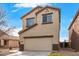 Charming two-story home with a neutral color palette and a convenient attached two-car garage at 35973 W Velazquez Dr, Maricopa, AZ 85138